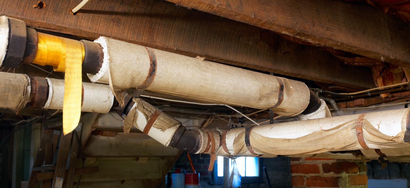 Asbestos Water Tank, Pipe & Flue Removal in Surrey, London & the South East: Asbestos water tank, pipe and flue removal